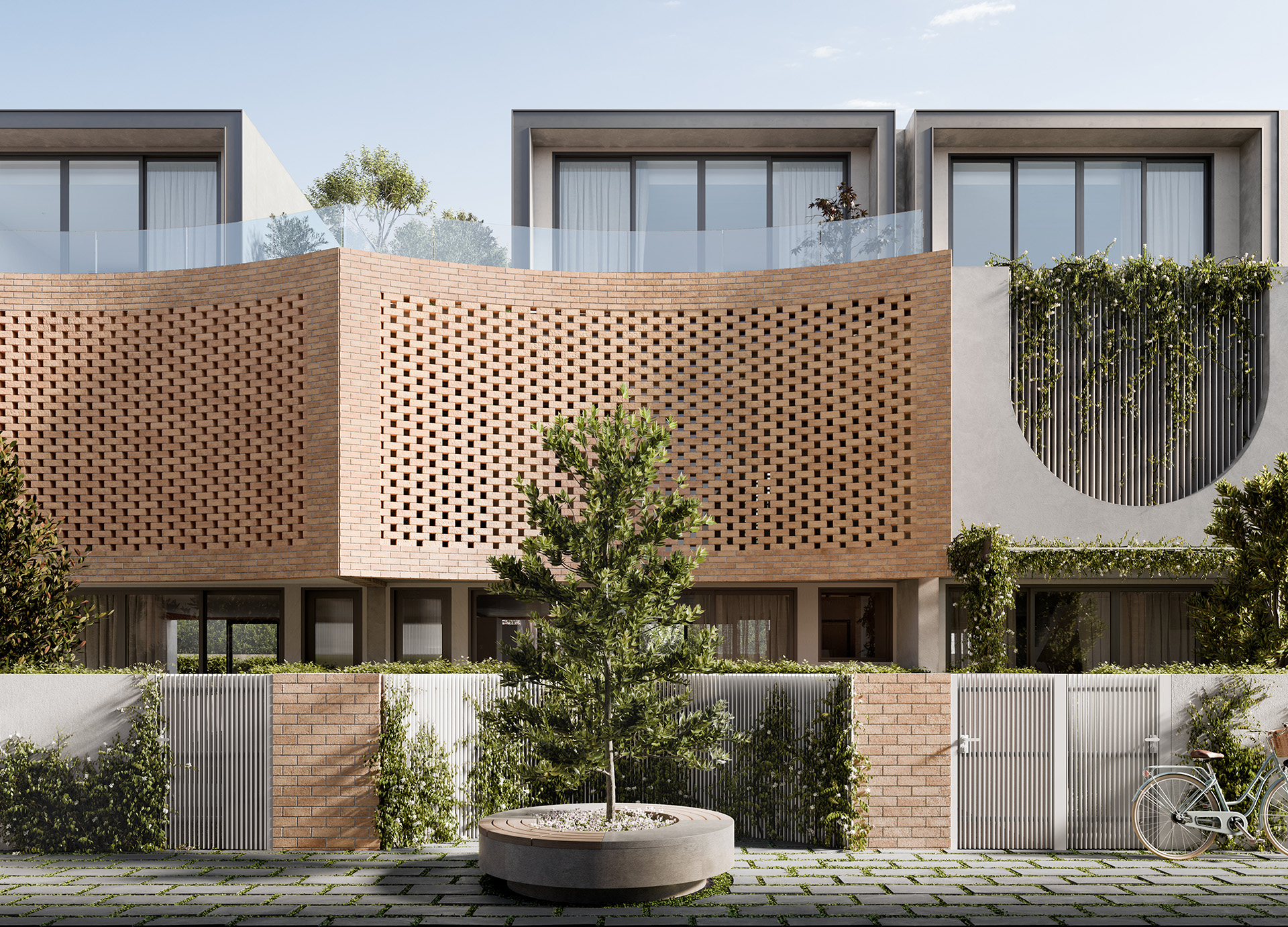 Contemporary townhouse facade with a curved, perforated brick privacy screen and glass balconies above, vine-covered vertical panels, and a circular courtyard planter with a young tree, highlighting modern design that blends privacy, ventilation, and greenery.