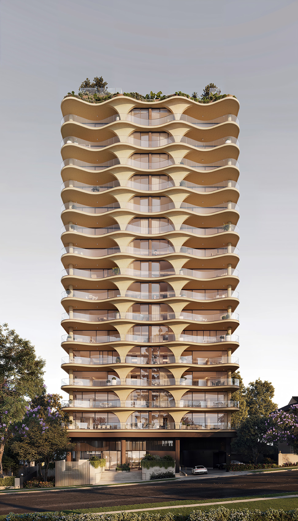 Luxury residential tower with undulating, wave-like balconies on every floor, warm beige facade and full-height glass windows, rooftop greenery, and a landscaped street-level entrance framed by trees and a parked car.