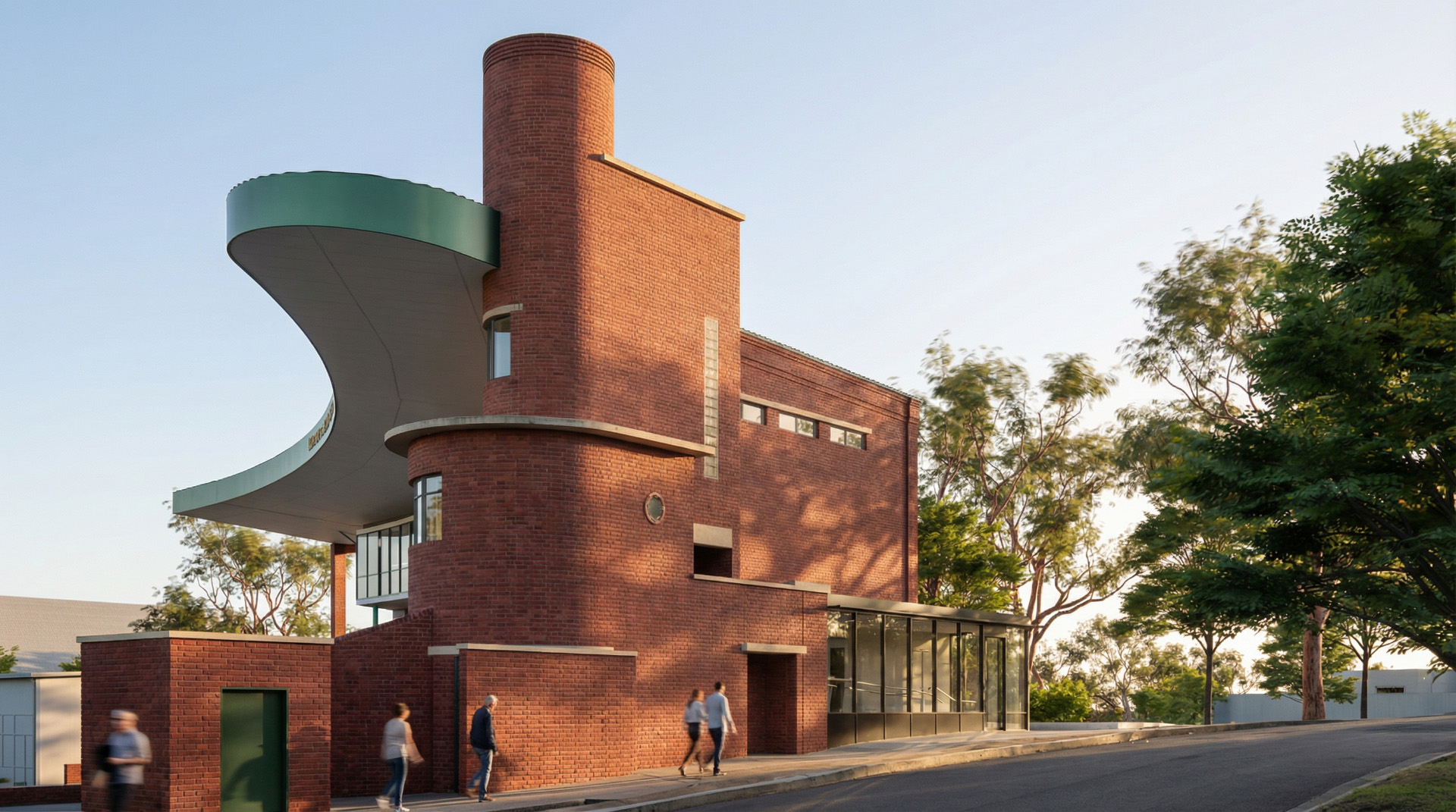 Red-brick exterior of the Michael Tuck Stand showing a tall cylindrical tower and a sweeping green cantilevered canopy, sunlit at golden hour as pedestrians walk along the sidewalk and trees frame the street.